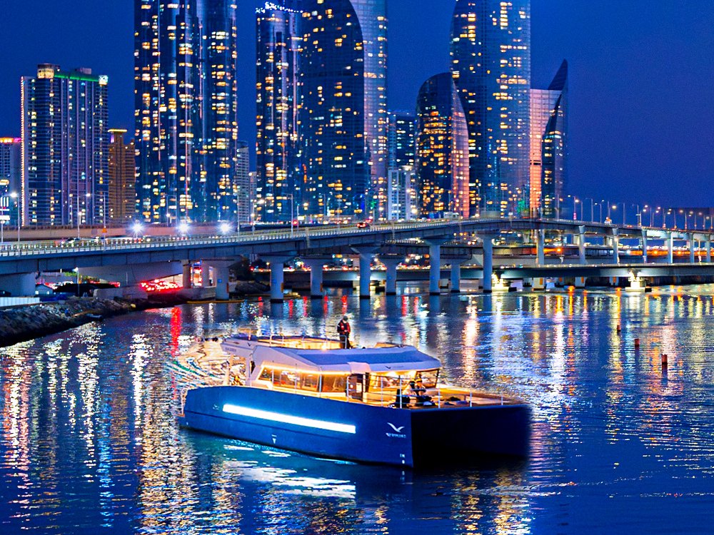 Haeundae River Cruise passing the Suyeong River in front of the Marine City night view